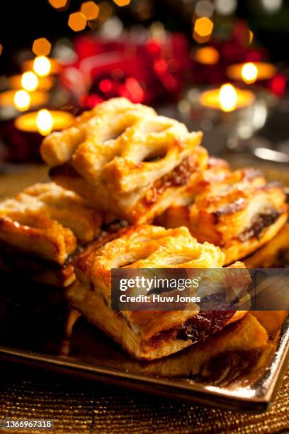 homemade puff pastry mince pies in a christmas table set - christmas mince pies stock pictures, royalty-free photos & images