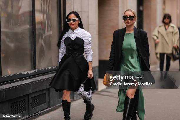 Miki Cheung and Justyna Czerniak are seen outside Alexis Mabille during Paris Fashion Week Haute Couture Spring/Summer 2022 on January 25, 2022 in...