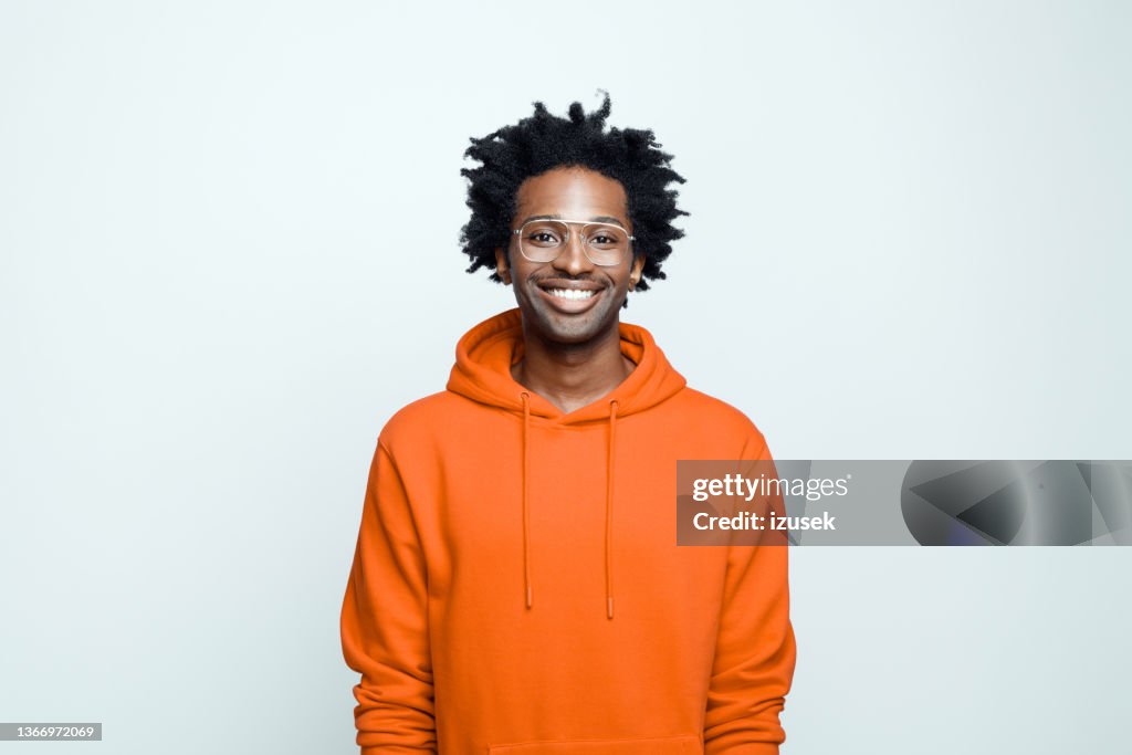 Portrait of cheerful man in orange hoodie