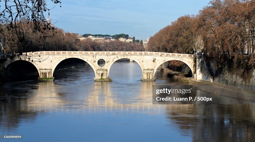 Morning sunlight on the Sisto Bridge,View of arch bridge over river against sky,Rome,Italy