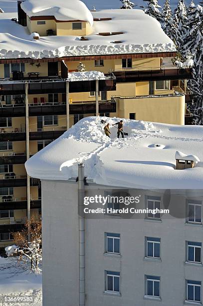 Swiss army soldiers dig snow trenches on a roof on January 10, 2012 in Davos, Switzerland. The World Economic Forum, which gathers the World's top...