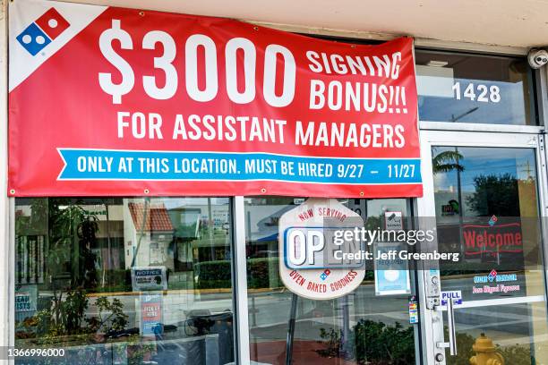 Miami Beach, Florida, Domino's Pizza, banner offering $3000 signing bonus for assistant managers.