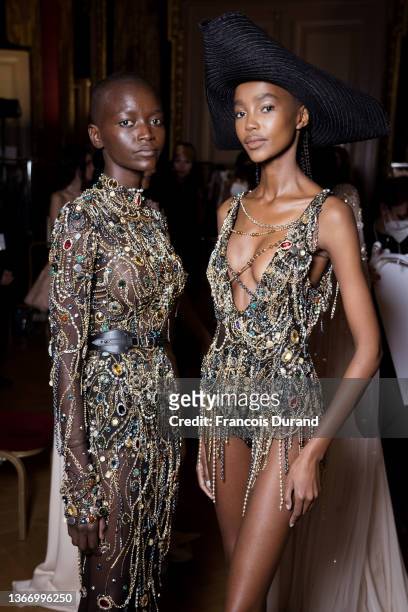 Models prepare backstage prior to the Zuhair Murad Haute Couture Spring/Summer 2022 show as part of Paris Fashion Week on January 26, 2022 in Paris,...