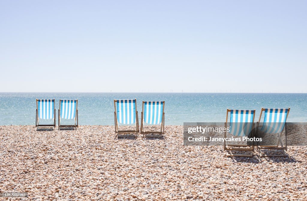 UK, Brighton, Deckchairs on beach