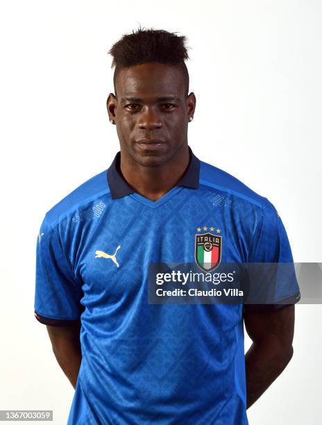 Mario Balotelli of Italy poses during an official portrait session after a Italy training session at Centro Tecnico Federale di Coverciano on January...