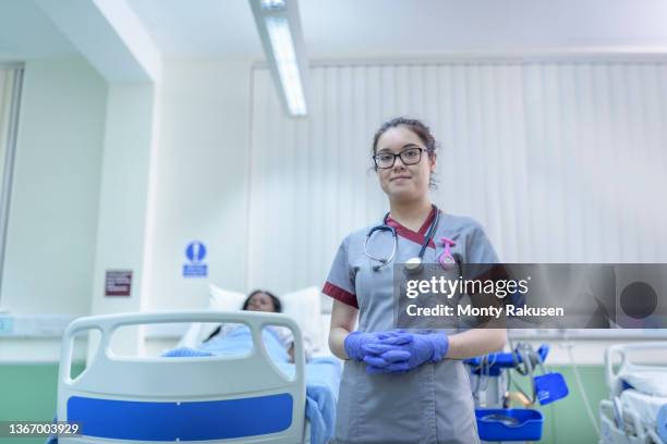 portrait of smiling nurse on hospital ward - sheffield uk stock pictures, royalty-free photos & images