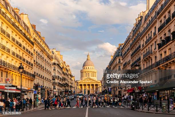 people crossing the street in font of pantheon in paris, france - paris summer bildbanksfoton och bilder