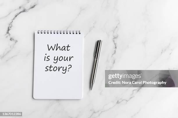 what 's your story phrase on note pad - story telling in the workplace stock pictures, royalty-free photos & images