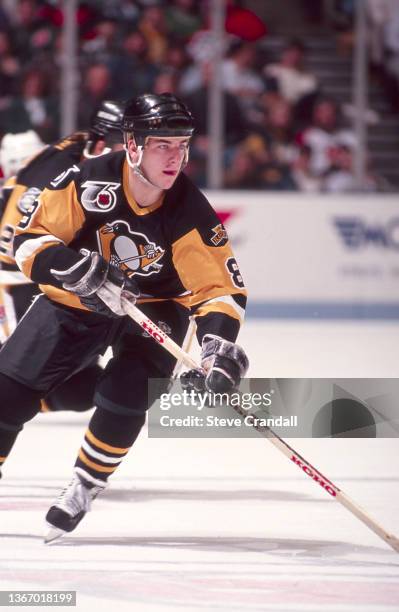 Mark Recchi, of the Pittsburgh Penguins, carries the puck into the Devils zone during their game with the New Jersey Devils in East Rutherford, New...