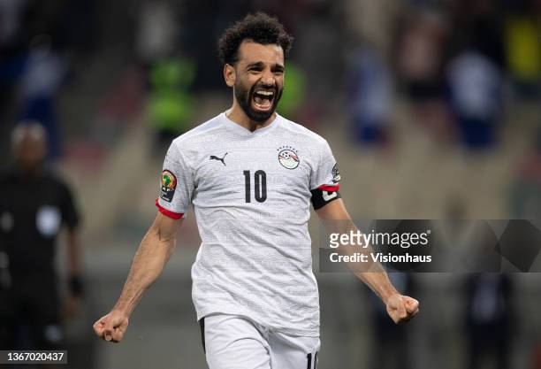 Mohamed Salah of Egypt celebrates after scoring the winning penalty and winning the Africa Cup of Nations 2021 round of 16 football match between...
