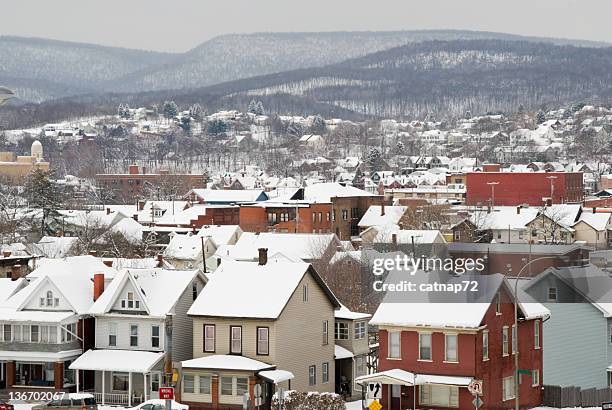 rooftops of an american town in snow, high angle - pennsylvania house stock pictures, royalty-free photos & images