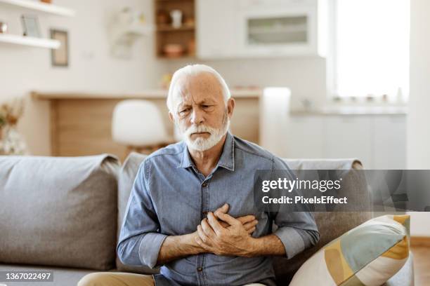 senior man with chest pain - human artery stock pictures, royalty-free photos & images