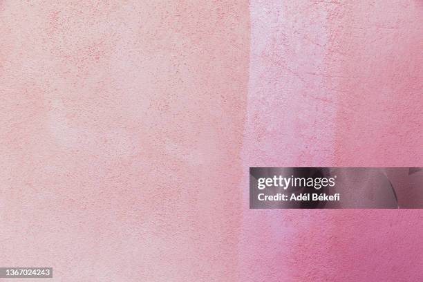 pink stone wall background - pink wall stock-fotos und bilder