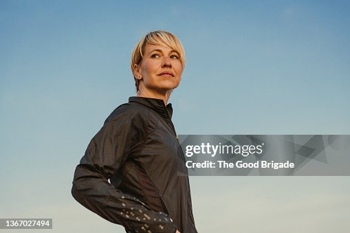 Portrait of beautiful woman standing against blue sky Portrait of beautiful woman standing against blue sky