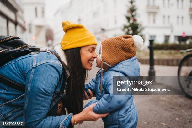 walking down the street - winter baby stockfoto's en -beelden