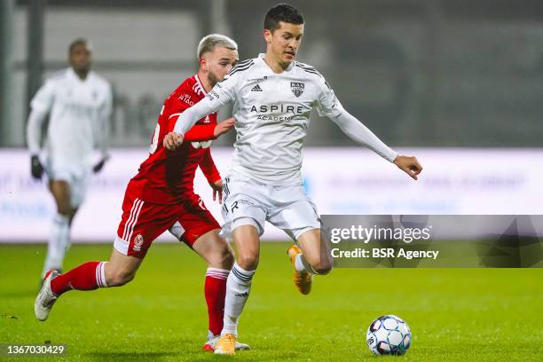 Nicolas Raskin of Standard de Liege battles for the ball with Stef Peeters of KAS Eupen during the Jupiler Pro League match between KAS Eupen and...