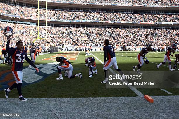 Playoffs: Denver Broncos players kneeling in prayers during game vs Pittsburgh Steelers at Sports Authority Field at Mile High. Denver, CO 1/8/2012...
