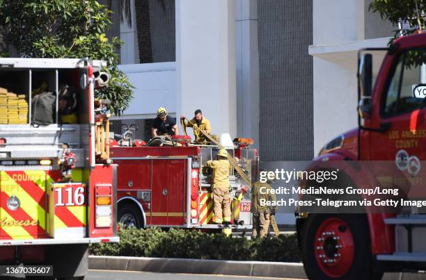 Hawthorne, CA Firefighters at the Hawthorne Plaza, clean up after fighting a fire there Wednesday morning in Hawthorne on Wednesday, January 26,...