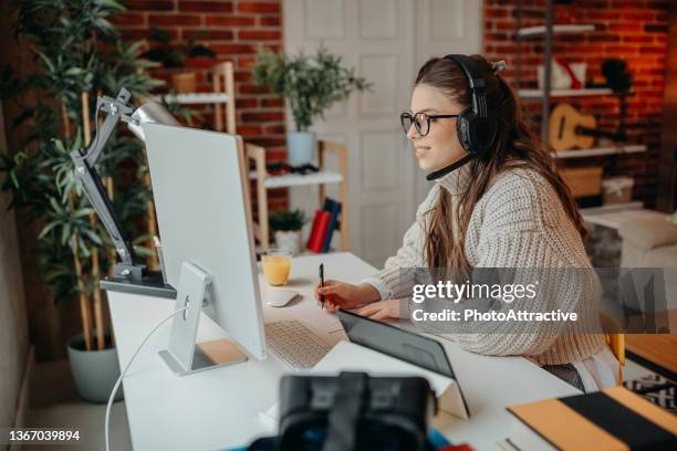 business woman having a video call with coworker - work from home stock pictures, royalty-free photos & images