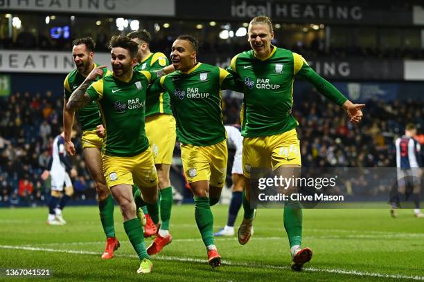 Cameron Archer of Preston North End celebrates with teammates Sean Maguire and Brad Potts of Preston North End after scoring their team's second goal...