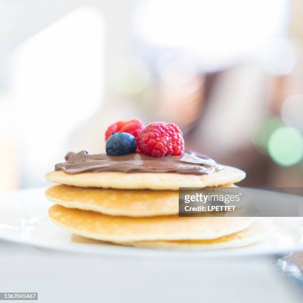 pancakes and fruit - chocolate spread stock pictures, royalty-free photos & images
