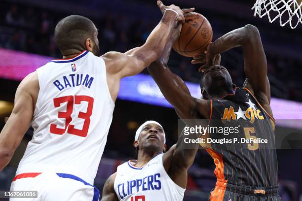 Mo Bamba of the Orlando Magic is fouled by Nicolas Batum of the LA Clippers during the first quarter at Amway Center on January 26, 2022 in Orlando,...
