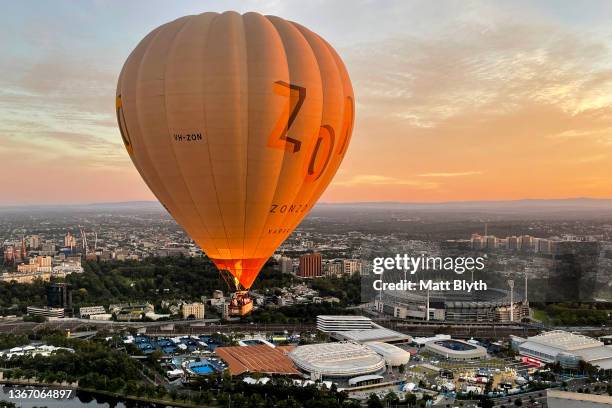 Hot air balloon is seen over the Melbourne Cricket Ground and Melbourne Park taken from a hot air balloon on January 24, 2022 in Melbourne, Australia.