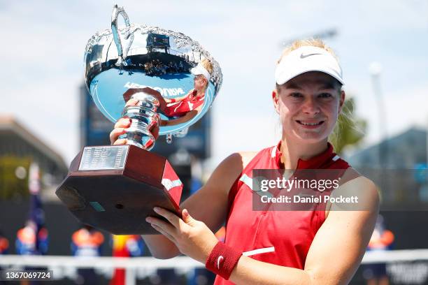 Diede De Groot of Netherlands poses with the trophy after winning her Women's Wheelchair Singles Final during day 11 of the 2022 Australian Open at...