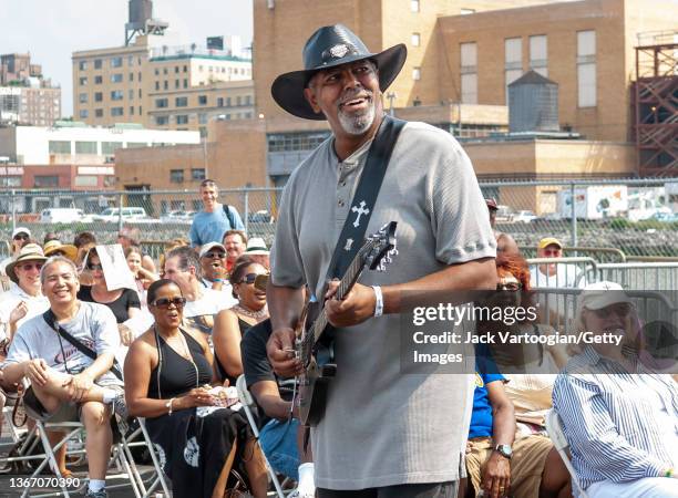 American Blues musician Zac Harmon plays guitar as he performs, with his band, onstage during the 7th annual Blues & Barbeque Festival in Hudson...