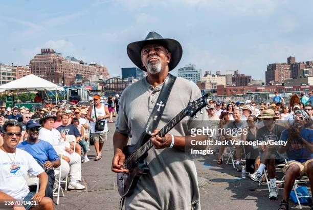 American Blues musician Zac Harmon plays guitar as he performs, with his band, onstage during the 7th annual Blues & Barbeque Festival in Hudson...