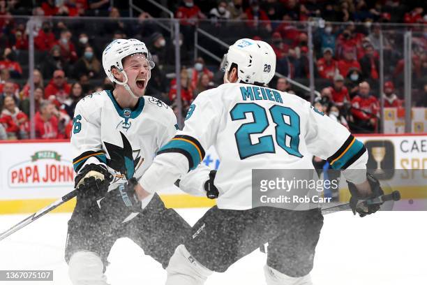 Jonathan Dahlen celebrates with Timo Meier of the San Jose Sharks after scoring a third period goal against the Washington Capitals at Capital One...