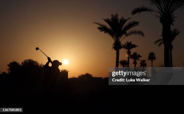 Romain Langasque of France plays his approach shot on the 10th hole during day one of the Slync.io Dubai Desert Classic at Emirates Golf Club on...