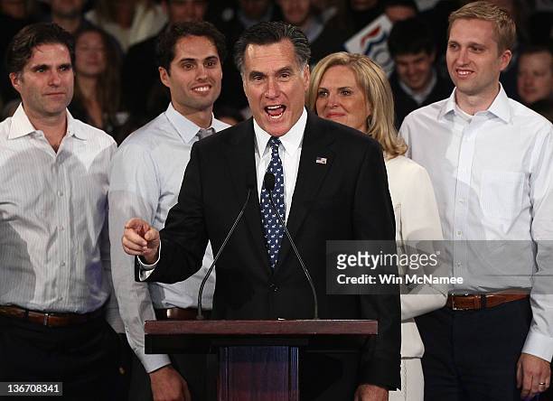 Republican presidential candidate and former Massachusetts Gov. Mitt Romney speaks during his primary night rally along side son's Tagg and Craig...