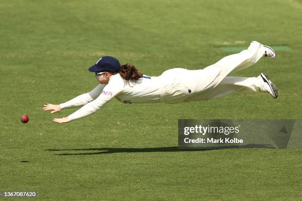 Tammy Beaumont of England dives for the ball in the field during day one of the Women's Test match in the Ashes series between Australia and England...