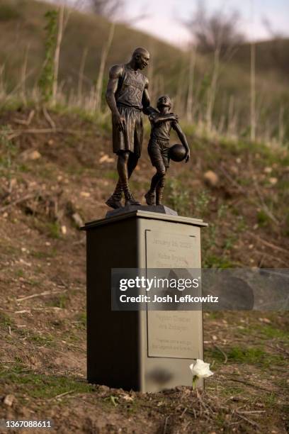 Artist Dan Medina's bronze sculpture depicting Kobe Bryant, daughter Gianna Bryant, and the names of those who died in a helicopter crash in 2020 is...