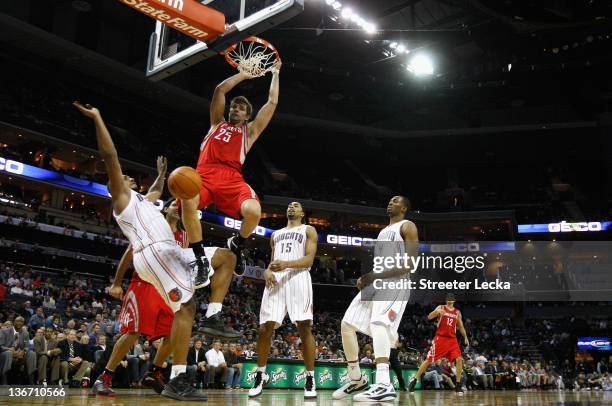 Chandler Parsons of the Houston Rockets dunks the ball on Boris Diaw of the Charlotte Bobcats during their game at Time Warner Cable Arena on January...