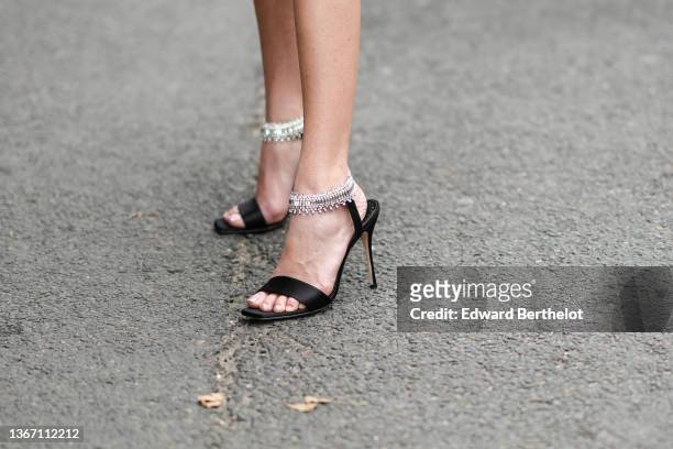 Mara Lafontan wears black satin with rhinestones strap pumps heels sandals, outside Zuhair Murad , during Paris Fashion Week - Haute Couture...