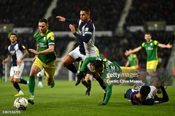 Cameron Archer of Preston North End is brought down by Darnell Furlong of West Bromwich Albion as Alan Browne of Preston North End runs to gain...