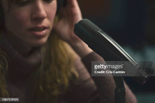 female radio host working in broadcasting studio - radio host imagens e fotografias de stock