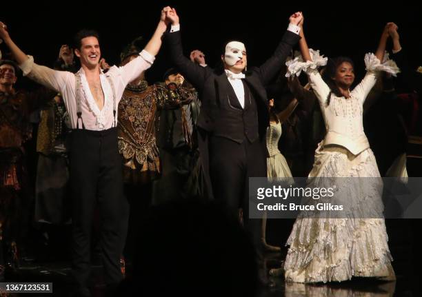 John Riddle as "Raoul", Ben Crawford as "The Phantom" and Emilie Kouatchou as "Christine" take the curtain call at The 34th Anniversary Performance...