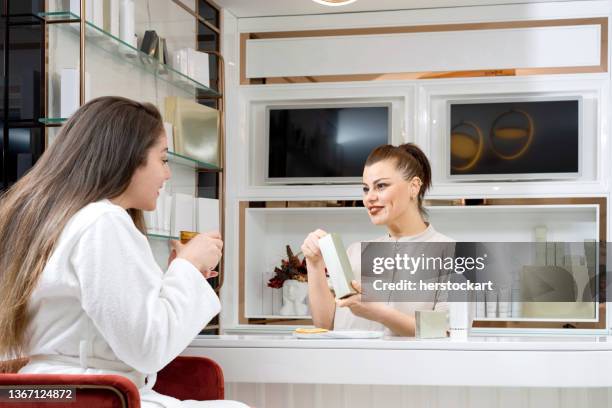 client on the reception of beauty salon - salon and spa stock pictures, royalty-free photos & images