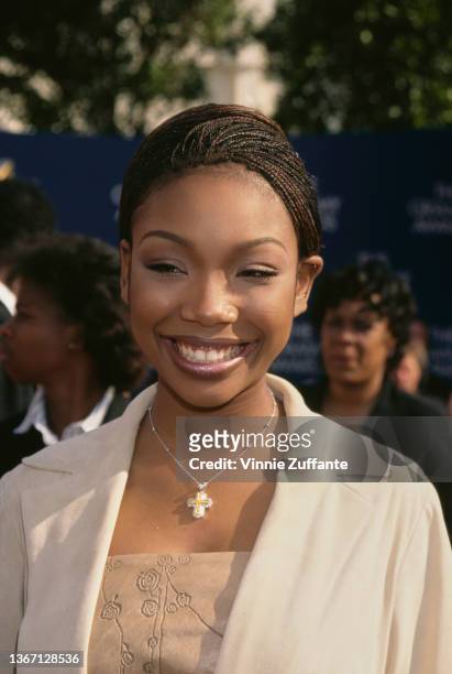 American singer, songwriter, and actress Brandy attends the 41st Annual Grammy Awards, held at the Shrine Auditorium in Los Angeles, California, 24th...