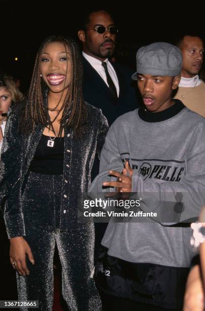 American singer, songwriter, and actress Brandy and her brother, American singer, songwriter, and actor Ray J attend the Hollywood premiere of 'Set...