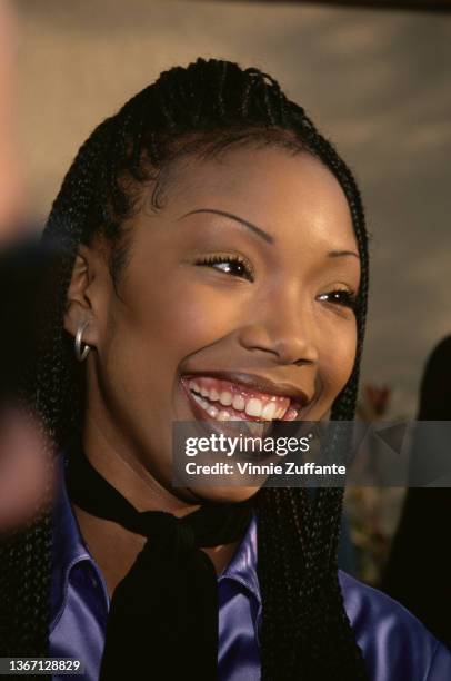 American singer, songwriter, and actress Brandy attends the 1996 MTV Movie Awards, held at Walt Disney Studios in Burbank, California, 8th June 1996.