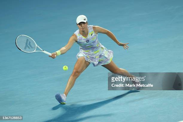 Iga Swiatek of Poland plays a forehand in her Women's Singles Semifinals match against Danielle Collins of United States during day 11 of the 2022...