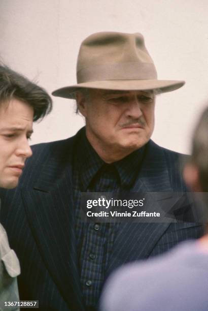 American actor Matthew Broderick and American actor Marlon Brando on the set of 'The Freshman' in the Little Italy neighbourhood of Lower Manhattan...