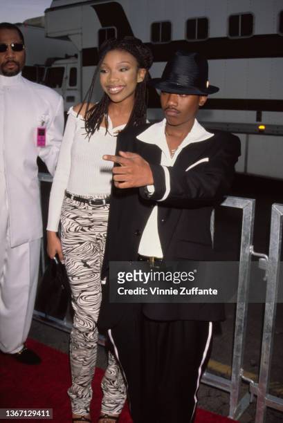 American singer, songwriter, and actress Brandy and her brother, American singer, songwriter, and actor Ray J attend the 24th Annual American Music...