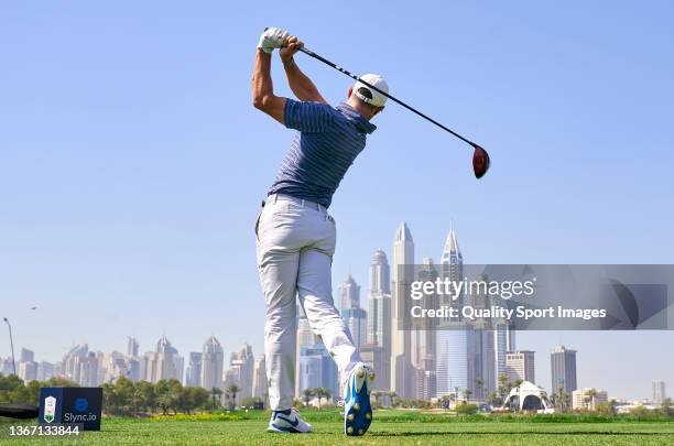 Rory McIlroy of Northern Ireland plays a shot during day one of the Slync.io Dubai Desert Classic at Emirates Golf Club on January 27, 2022 in Dubai,...