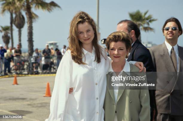 British actress Emily Watson, wearing a white shirt, with her arm around British actress Brenda Blethyn, wearing a grey jacket over a white shirt and...