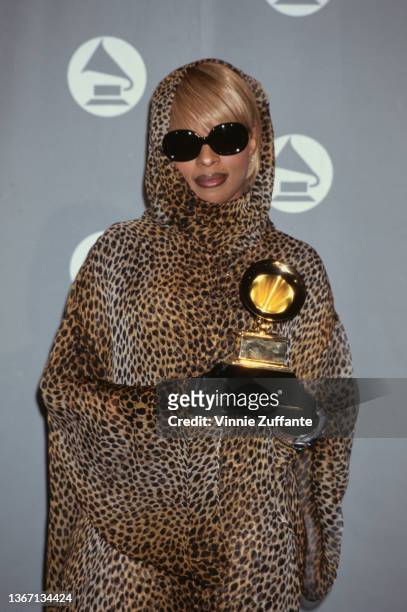 American singer and songwriter Mary J Blige, wearing a leopard print outfit with headscarf and sunglasses, in the press room of the 38th Annual...